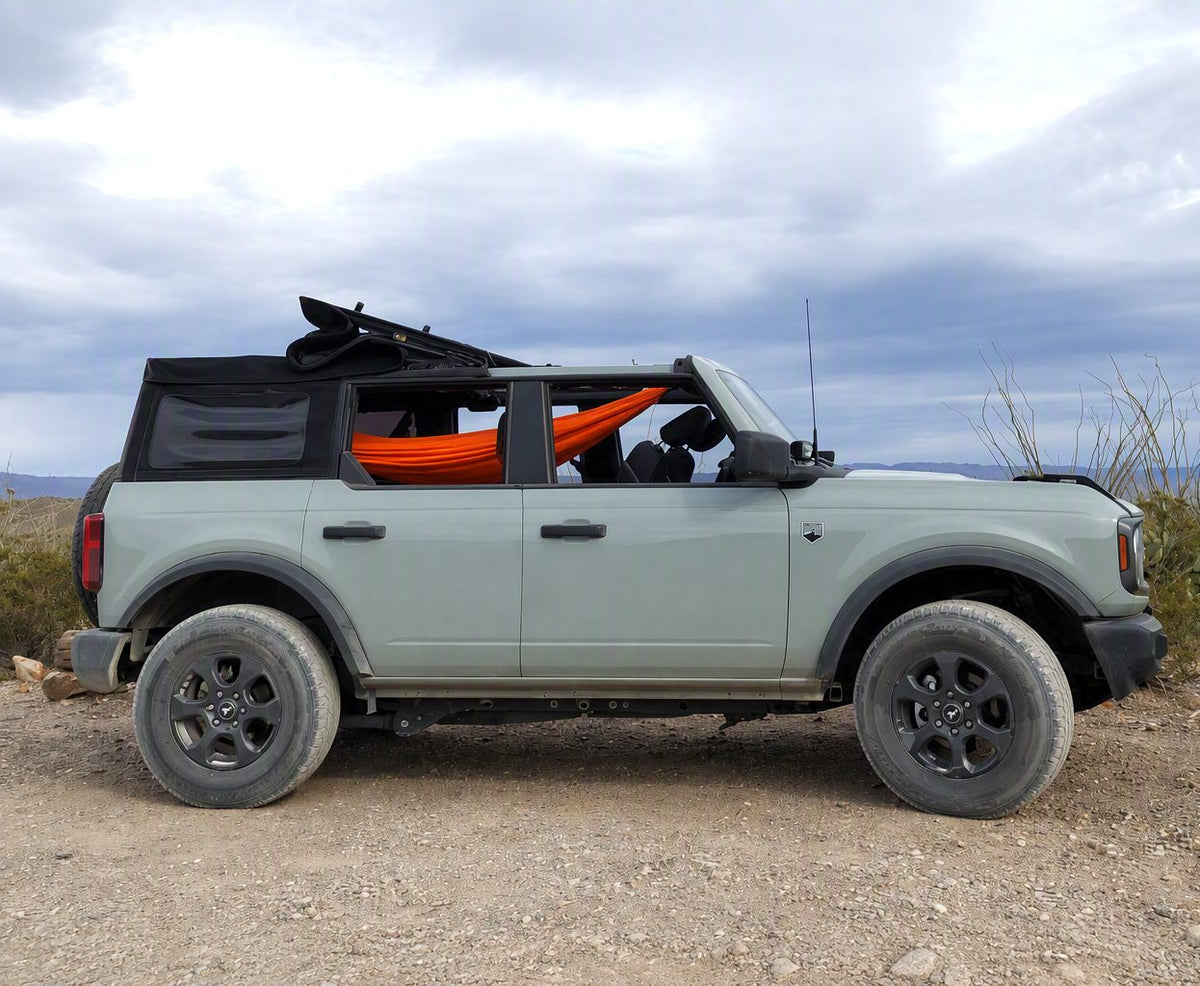 Bronco 4-Door hammock hung inside the vehicle at camp