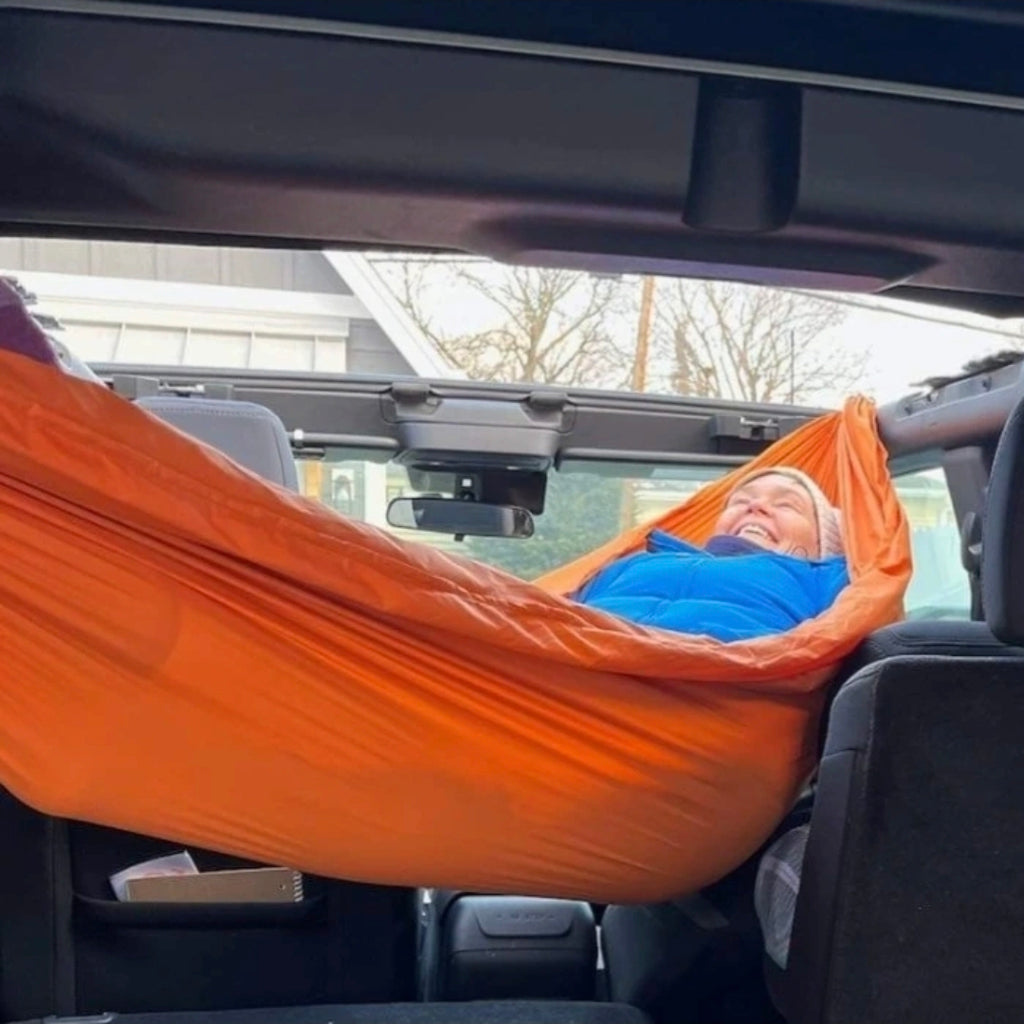 Meraki solo hammock installed inside a Gen 6 Ford Bronco 4-Door with no-drill roll bar brackets - photo 1